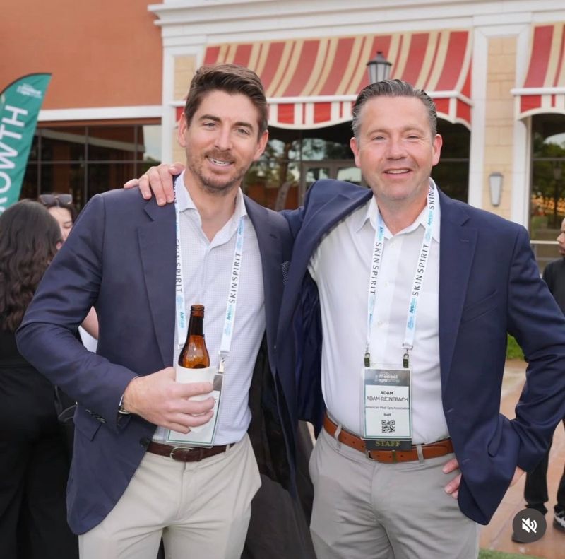 Two attendees smiling together at the Medical Spa Show